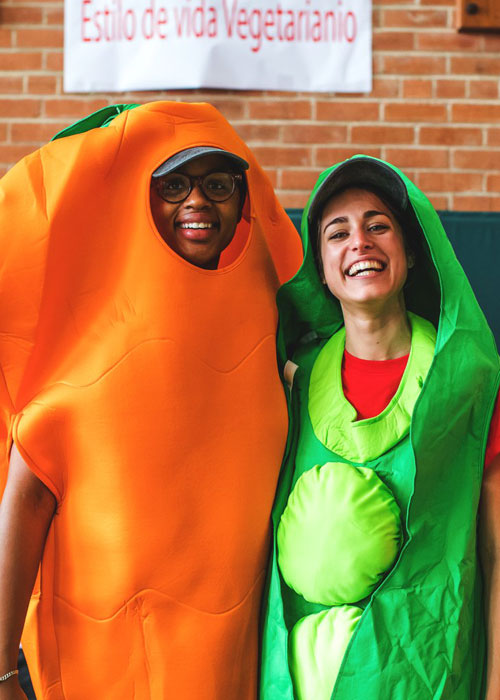 two students in vegetable costumes