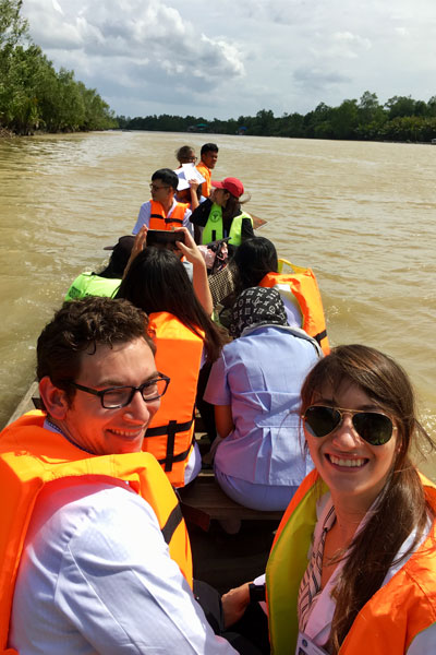 Traveling with physicians and nurses by canoe to a home visit for an elderly patient in Surat Thani