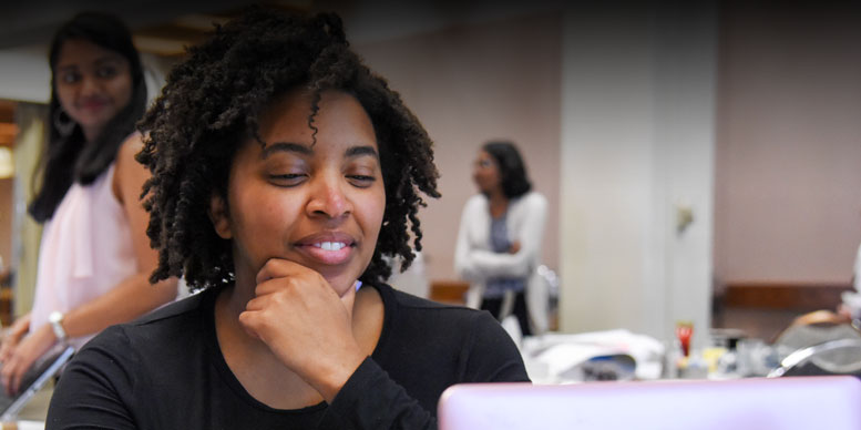 Woman with her hand on her chin looking pensive